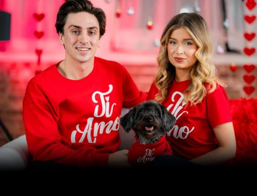 Italian couple on a couch with small dog